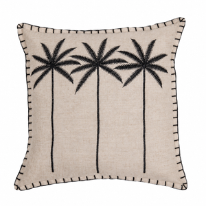 A square beige linen throw pillow featuring a black embroidered design of four palm trees and a black stitched border, shown against a plain white background.
