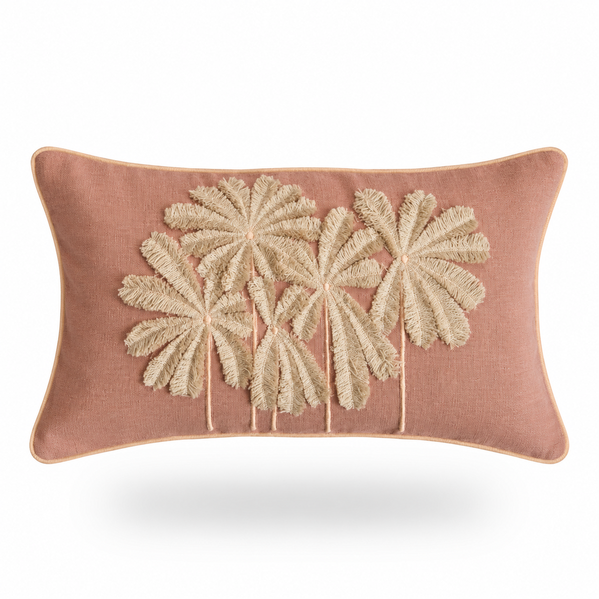 A rectangular dusty rose throw pillow featuring a raised, textured beige palm tree motif on the front, set against a clean white background with a soft drop shadow.