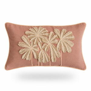 A rectangular dusty rose throw pillow featuring a raised, textured beige palm tree motif on the front, set against a clean white background with a soft drop shadow.